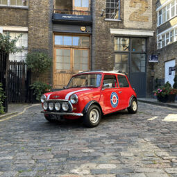 classic red white mini cooper jules small car big city hire london