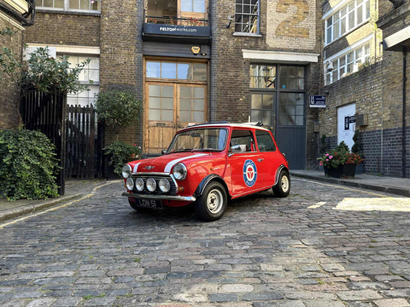 classic red white mini cooper jules small car big city hire london