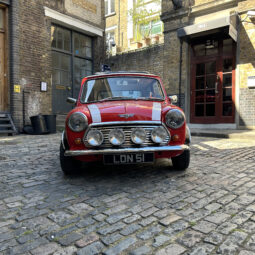 classic red white mini cooper jules small car big city hire london.jpeg grill