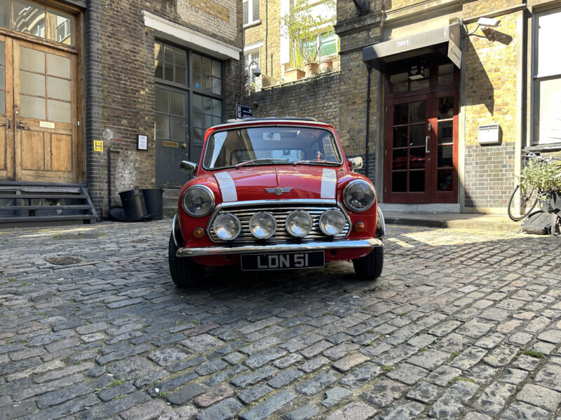 classic red white mini cooper jules small car big city hire london.jpeg grill