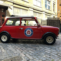 classic red white mini cooper jules small car big city hire london.jpeg off side