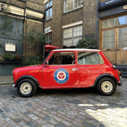 classic red white mini cooper jules small car big city hire london.jpeg side