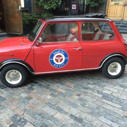 Rosie one of smallcarBIGCITY classic mini Coopers in red with a black roof and white cooper s revers rims
