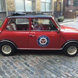 Rosie one of smallcarBIGCITY classic mini Coopers in red with a black roof and white cooper s revers rims