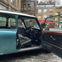 Classic-Mini-Cooper-Hire-London-Blue-Mini-Court-Yard-interior-driver