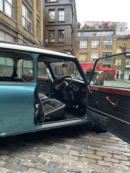 Classic-Mini-Cooper-Hire-London-Blue-Mini-Court-Yard-interior-driver