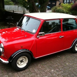 Classic Mini Cooper red with white wheels and roof