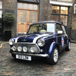 Dot D13LDN classic Mini Cooper Sports Pack in blue in London court yard front view