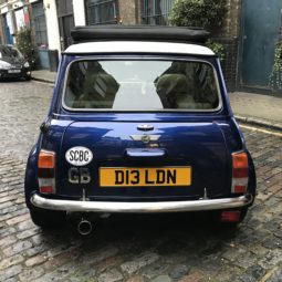 Dot D13LDN classic Mini Cooper Sports Pack in blue in London court yard rear boot view - smallcarBIGCITY