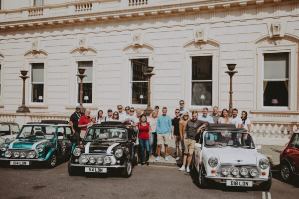 smallcarBIGCITY - Classic Mini Cooper hire - Car tours of London - Team Building - Group photo at Waterloo Place