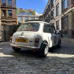 Classic White Mini Cooper hire london small car big off side rear quater