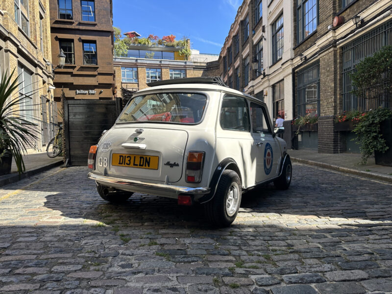 Classic White Mini Cooper hire london small car big off side rear quater